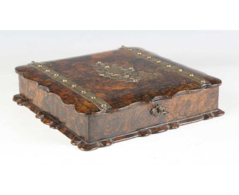 A mid-19th century French papier-mâché simulated walnut and brass bound card game box, the hinged lid enclosing various playi