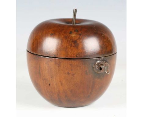 A George III fruitwood tea caddy in the form of an apple, the hinged lid with stalk finial, diameter 11.5cm.