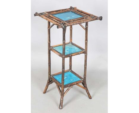 A late Victorian Aesthetic Movement bamboo three-tier table, inset with three turquoise glazed tiles by Minton Hollins &amp; 