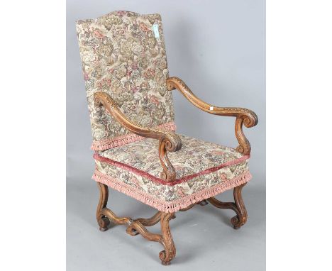 A late 19th century French Baroque Revival walnut framed armchair, upholstered in machined tapestry, height 117cm, width 65cm