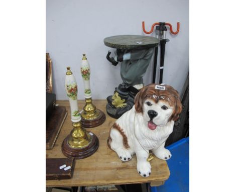 A Pair of Beer Pump Paperweights, 39cm high, model St Bernard Dog, Charlie Chaplin table. (4)