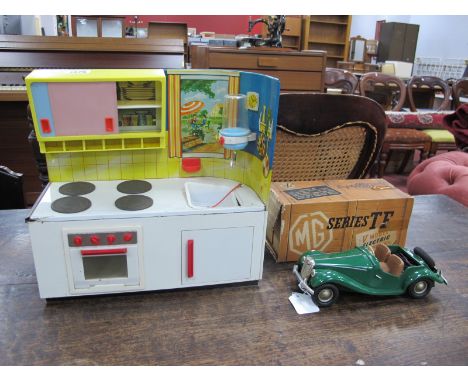A Circa 1950's Victory Model Boxed MG. TF. Plus a 1960's Michael Fuchs Tinplate Kitchen, 30.5cm wide. (2)