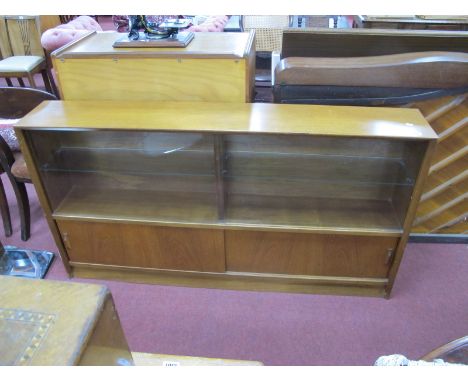 A Teak Bookcase, circa 1970's with sliding glazed doors an lower wooden doors, missing shelf, 152cm wide.