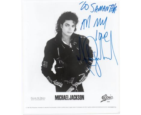Michael Jackson signed promo photo. A 20cm x 23cm promo photo clearly signed by Michael Jackson in blue marker and dedicated 