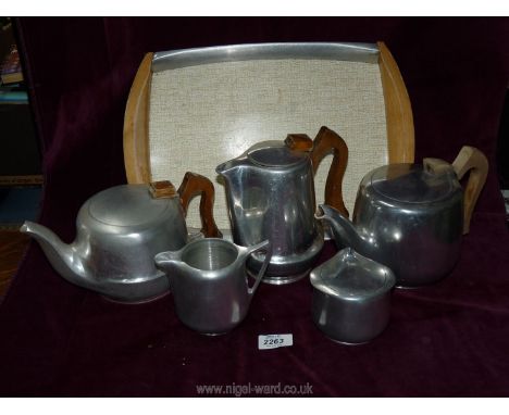 A Picquotware teapot, sugar bowl, milk jug and tray.