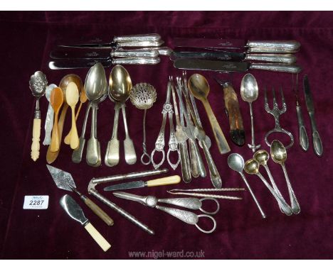 A quantity of cutlery including berry &amp; sifter spoons, lobster picks, bottle opener, grape scissors, stilton trowel etc.