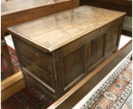 An 18th Century oak mule chest, together with a circa 1800 oak tea table, the circular plank top on pedestal (cut down) to tr