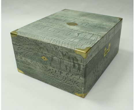 A green limed oak and brass bound trunk by Gustave Keller, the lock stamped "Gustave Keller Fabricant Orfevre 22 Rue Joubert 