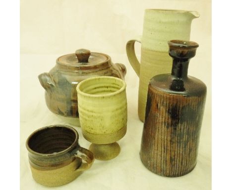 A collection of studio pottery by Colin Pearson to include casserole dish in brown glaze, jug and six mugs, six cream ground 