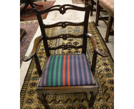 A 19th century mahogany framed carver chair with lotus leaf decorated slat back, a Chippendale design carver chair and a maho