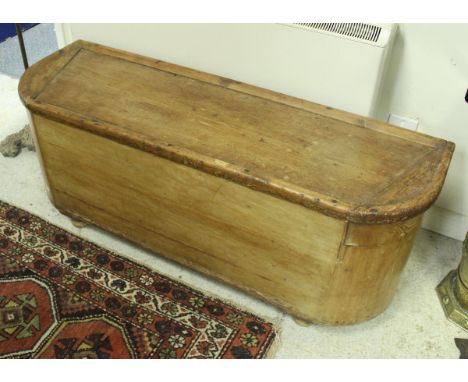 A Victorian waxed pine hall trunk or coffer with bowed ends and plain panelled rising top