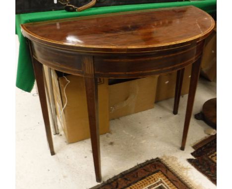 A Regency mahogany and rosewood cross-banded demi-lune card table