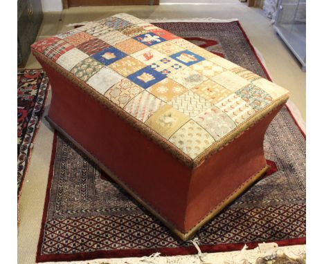 A Victorian upholstered box ottoman with needlework decorated seat over waisted sides on squat bun feet CONDITION REPORTS The