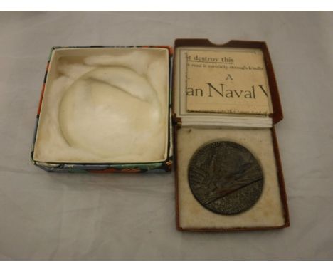 A boxed "The Lusitania (German)" medal, together with a convex lens