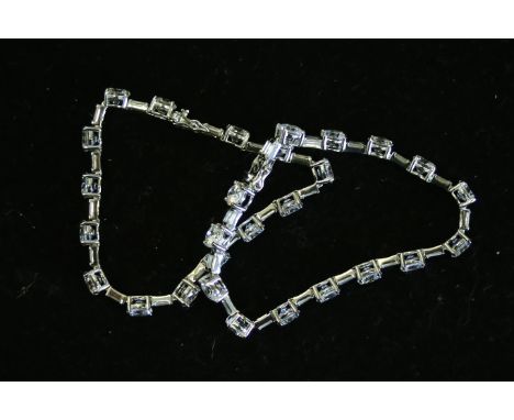 A pair of two good CZ set silver bracelets