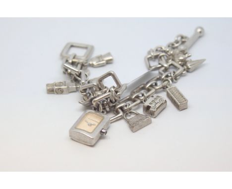 Burberry, silver charm bracelet watch, silver charm bracelet with 10 charms including 'B' , London bus, Big Ben, pendant watc