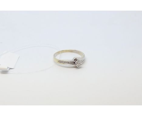 Diamond ring, central brilliant cut diamond with diamond set shoulders, estimated total diamond weight 0.25ct, ring size R
