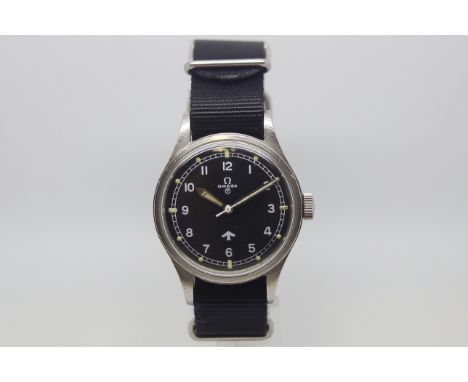 Vintage Military Omega 53 'Fat Arrow', black circular dial marked with British military crows foot and tritium T mark, white 
