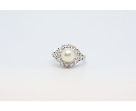 Pearl and diamond cluster ring, 7.25mm pearl set within a cluster of brilliant cut diamonds, estimated total diamond weight 0