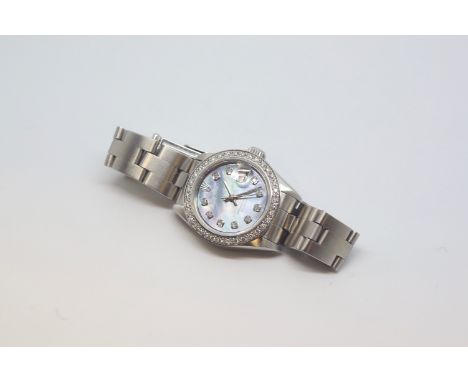 Ladies Rolex Oyster Perpetual Date Just, dark mother pearl diamond dot dial with diamond outer bezel, stainless steel case an