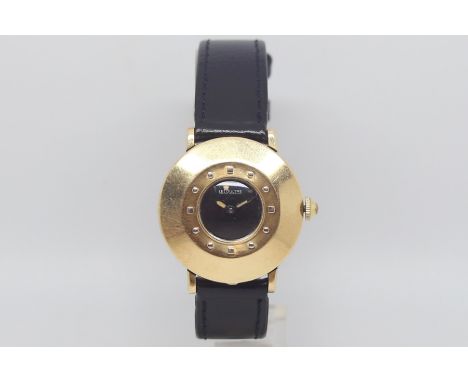 Vintage LeCoultre, circular black dial, heavy gold case with raised hour markers, inner case back marked 'cased in the USA by