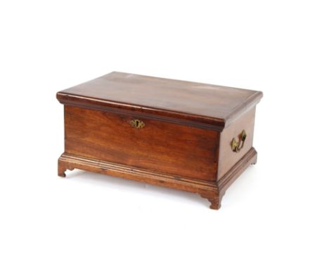 An Antique fruitwood box, flanked by brass carrying handles and raised on bracket supports, 47cm wide
