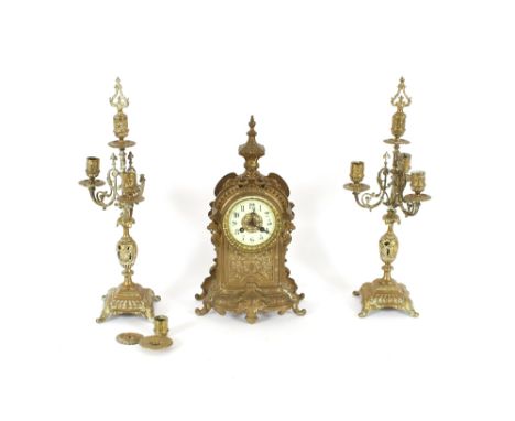 A 19th Century French gilded brass clock garniture, with four light candelabra, the 8 day movement by Japy Freres