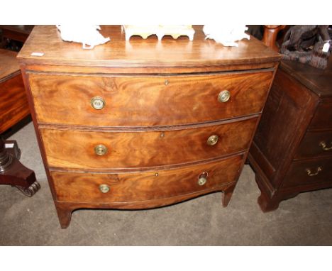 A Georgian mahogany bow fronted chest, of three long drawers, raised on a shaped apron and bracket feet, 100cm wide