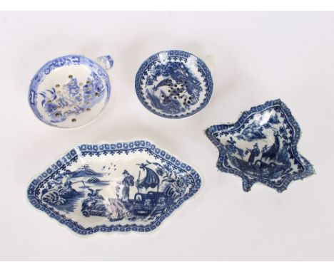 An 18th Century English porcelain blue and white strainer, decorated in the Chinese manner; a later similar; an 18th Century 