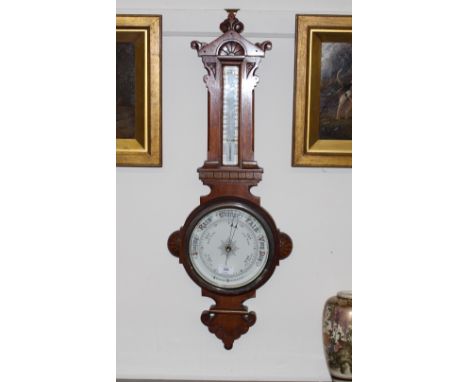 An Edwardian walnut aneroid barometer/thermometer