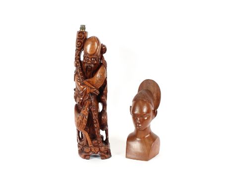 An oriental hardwood table lamp base, in the form of a Sage with staff, attendant deer and a crane, 68cm high; and a carved h