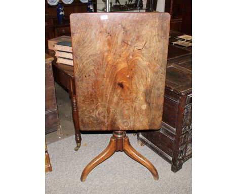 A 19th Century mahogany snap top occasional table, raised on a ring turned baluster column and tripod base, the top 77cm x 56