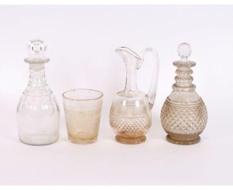 A 19th Century hobnail cut triple ring neck decanter; a similar claret jug; a maul shape decanter with thumb press decoration