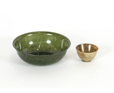 A spinach green jade bowl, 13.5cm dia.; and a small grey hardstone bowl, 5.5cm dia., (2)