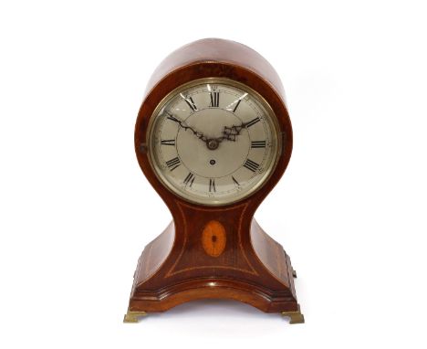 A late 19th early 20th Century mahogany and satinwood inlaid balloon shaped mantel clock, the silvered circular Roman numeral