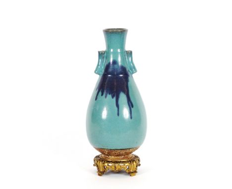 An unusual oriental blue glazed arrow vase, raised on an ormolu base, 46.5cm high