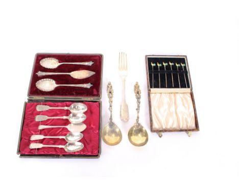 A cased silver preserve set, comprising a butter knife, and two jam spades, Sheffield 1889-1890; a cased set of white metal a