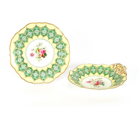 An early 20th Century Copeland part dessert service, with green and ivory banded borders, heightened in gilt, central floral 