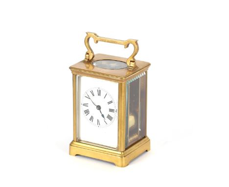 A brass cased carriage clock, having striking movement, stamped R & Co., Paris, white enamel Roman numeral dial, 11cm high