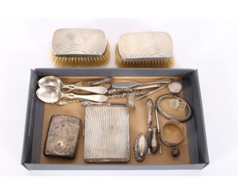 A pair of silver backed hair brushes, of Art Deco design; a similar plated cigarette case; a silver cigarette case; various s