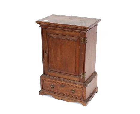 A 19th Century mahogany spice cupboard, fitted seven interior drawers enclosed by a fielded panel door, single drawer below, 