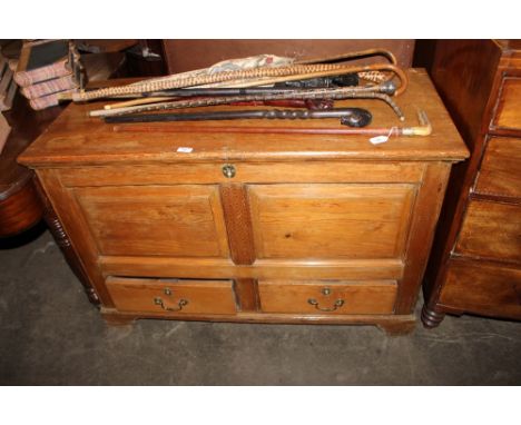 A Georgian pine mule chest, the hinged lid opening to reveal candlebox interior, having  moulded panelled fronts and sides, t