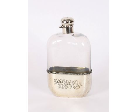 A large pint sized cut glass and sterling mounted hip flask, with monogrammed detachable cup, 19.5cm