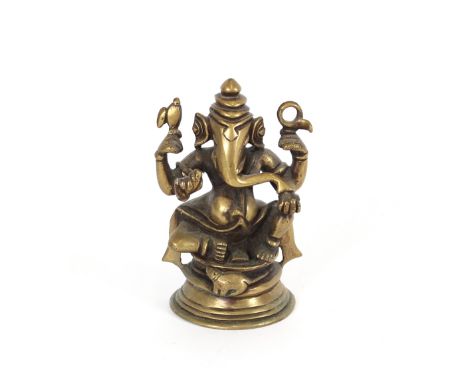 A small Chinese bronze baluster vase, having raised floral decoration, 9.5cm high; a  bronze study of Ganesh, 12cm high; and 