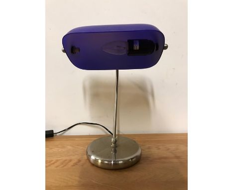A contemporary desk lamp with blue shade 