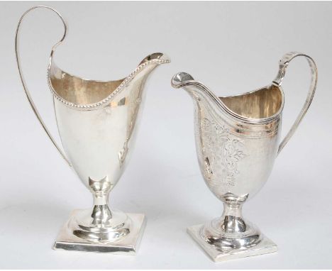 Two George III Silver Cream-Jugs, One by John Lambe, London, 1784 and One London, 1798, each helmet-shaped and on square foot