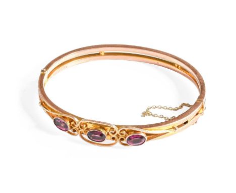 A Paste Hinged Bangle, inner measurements 5.7cm by 4.9cmStamped '9CT'. Gross weight 9.1 grams.