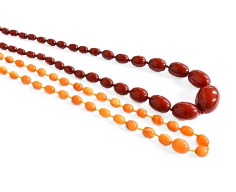 A Graduated Amber Bead Necklace, length 112cm; together with A Graduated Red Amber Bead Necklace, length 79cmFirst example - 