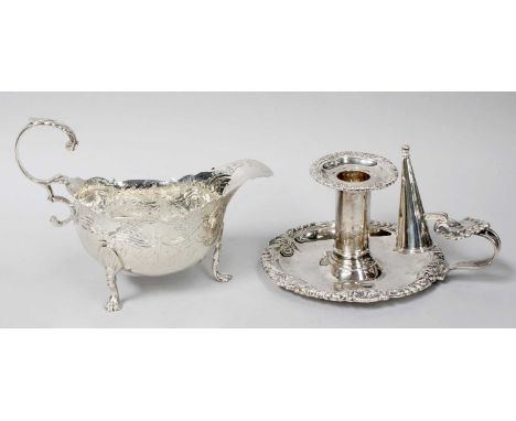A George III Silver Sauceboat and an Edward VII Silver Chamber-Candlestick, the first by Abraham Peterson and Peter Podio, Lo