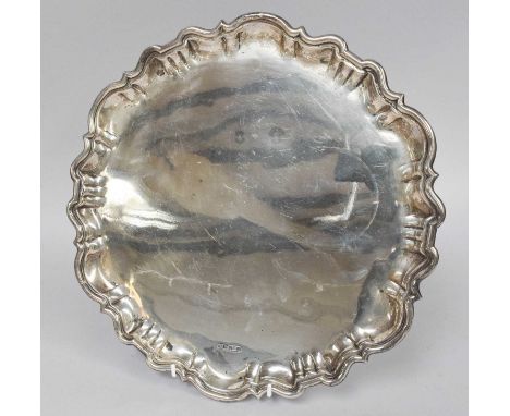 An Edward VII Silver Salver, by Roberts and Belk, Sheffield, 1903, shaped circular and on three stepped panel feet, 29.5cm di